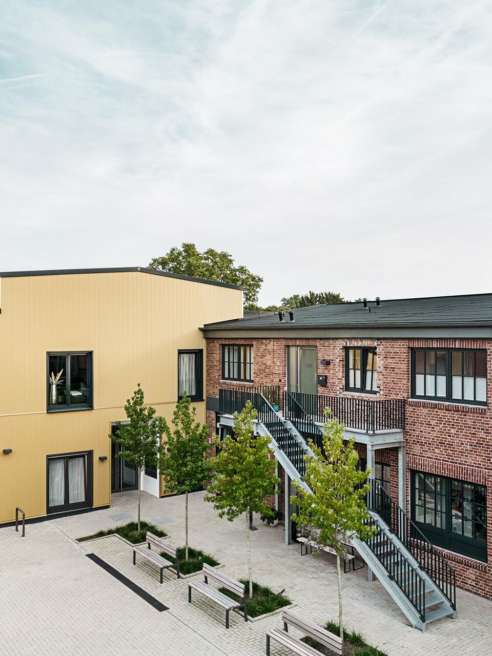 Normal view of the Kellerhöfe in Langenfeld that Rotterdam Dakowski Architekten turned into 23 rental apartments and an office space.