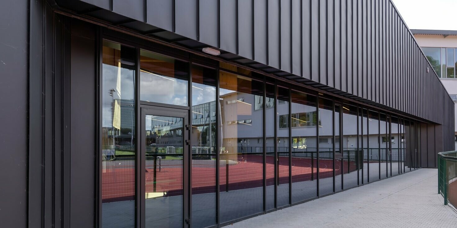 New construction of the Mardyke Arena at University College Cork in Ireland wrapped with PREFALZ in P.10 Black