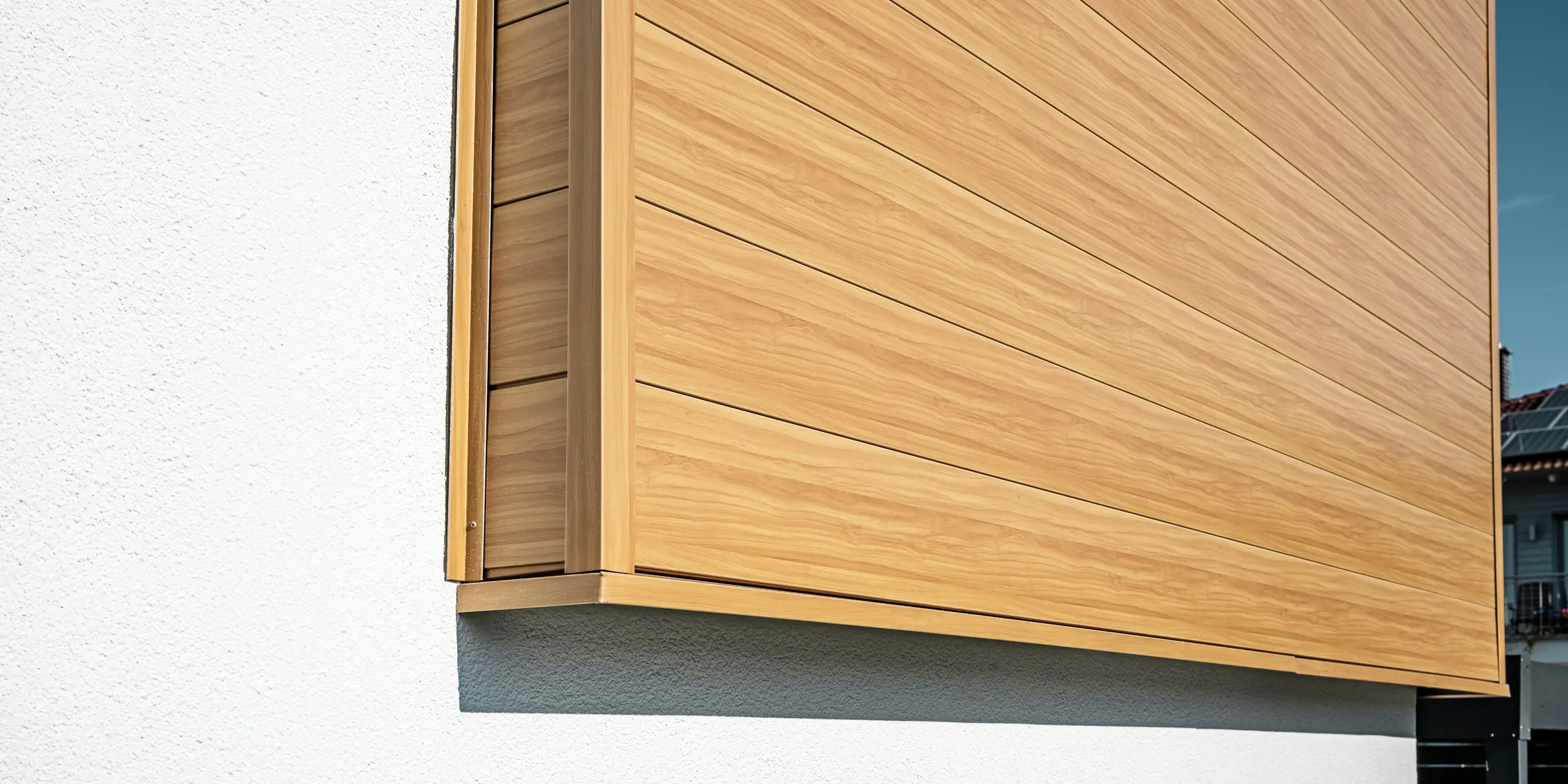 Close-up of the aluminium façade made of PREFA sidings in the natural oak colour on a detached house in Usingen, Germany