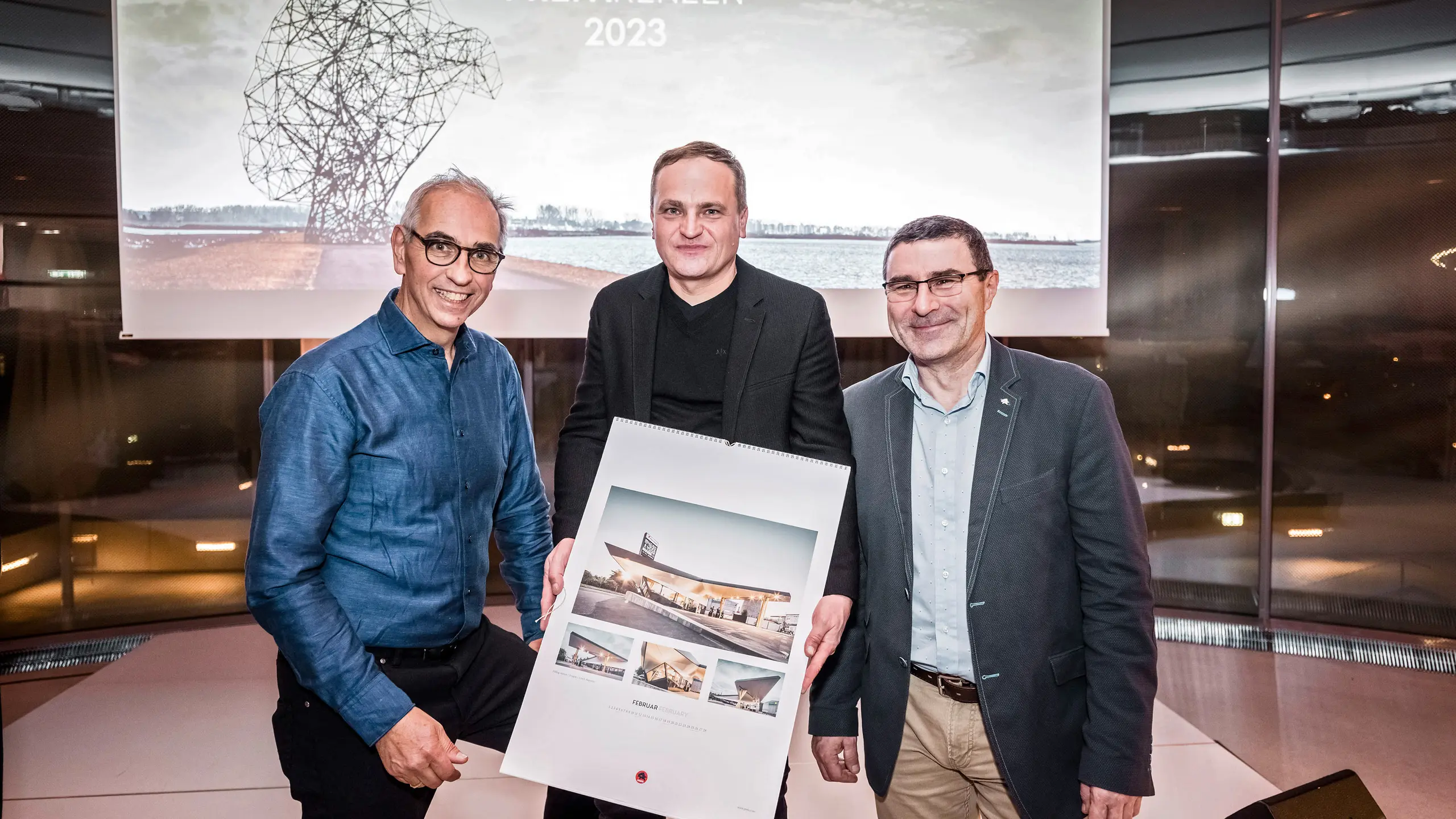 Wolfgang Croce, Daniel Zerzán holding the calendar.