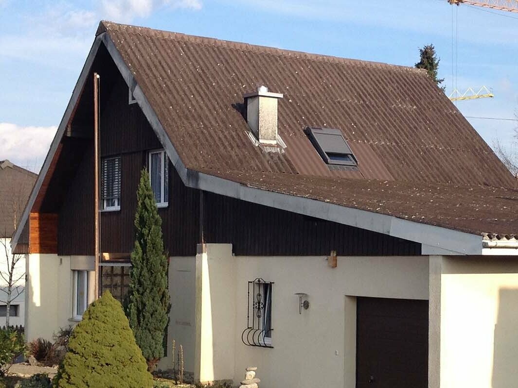 House before roof renovation with PREFA roof tiles, gable roof and garage