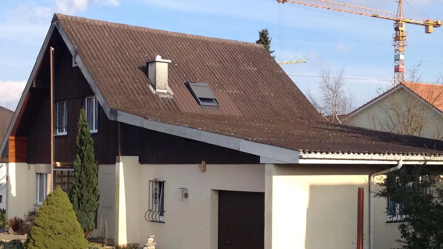 House before roof renovation with PREFA roof tiles, gable roof and garage