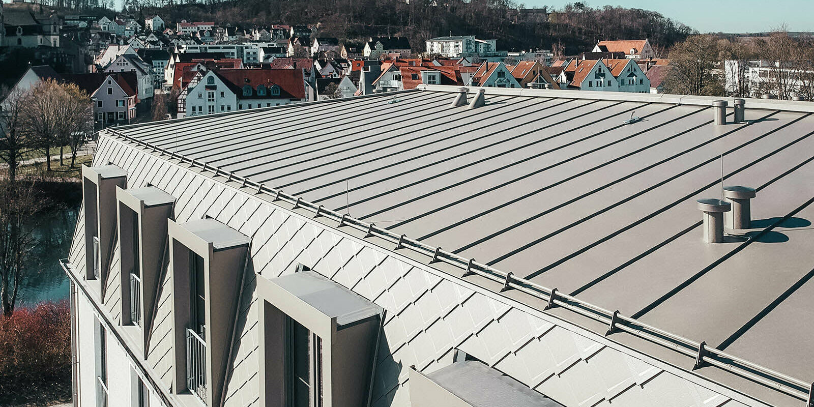 View of the roof surface with PREFA rhomboid roof and façade tiles and Prefalz roofing membranes