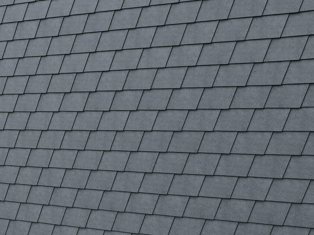 Detailed image of the PREFA façade shingle in P.10 stone grey