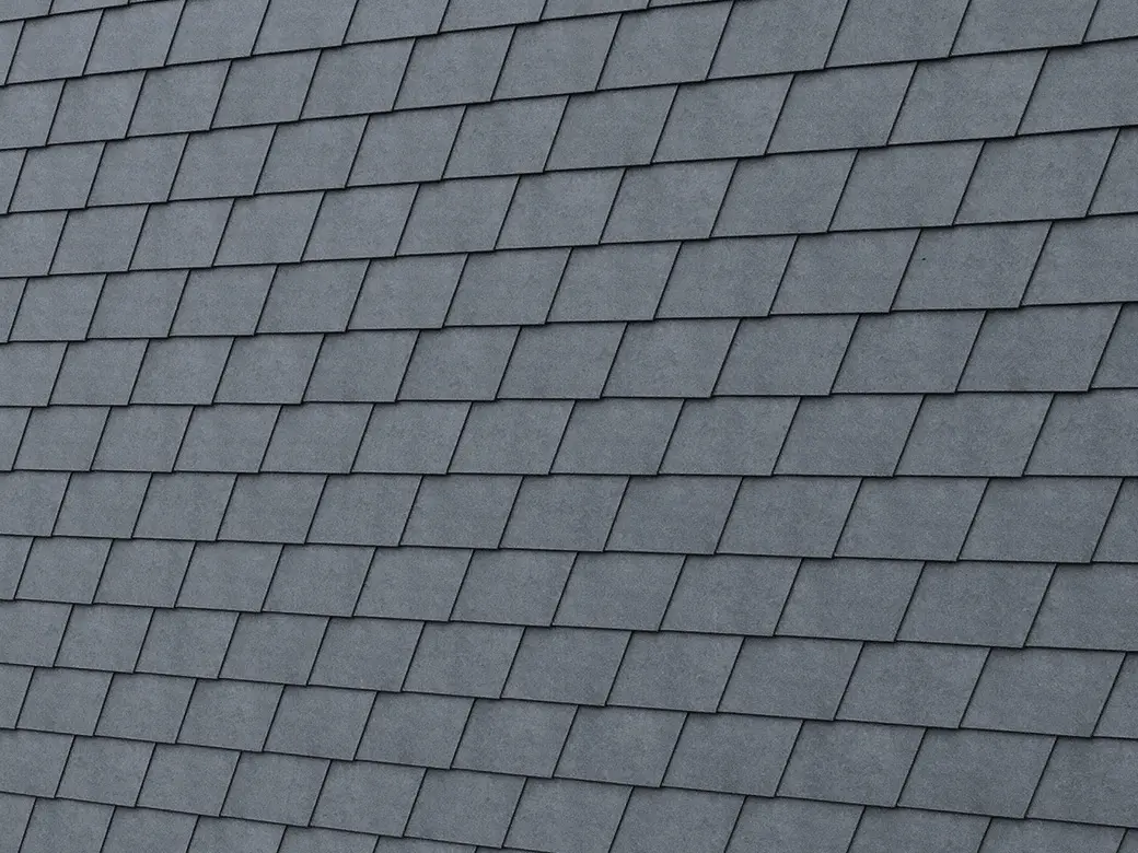 Detailed image of the PREFA façade shingle in P.10 stone grey