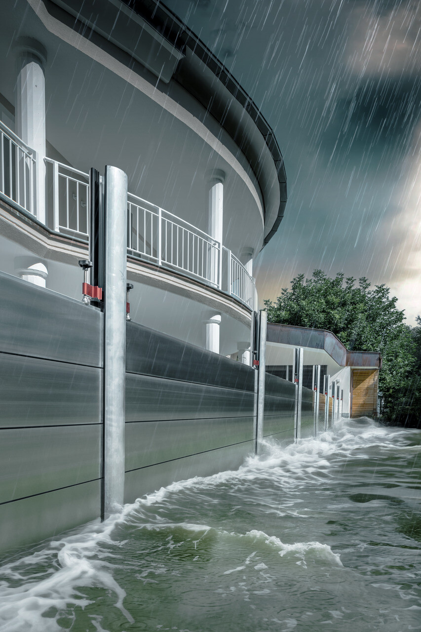 Close-up of the PREFA flood protection made of aluminium, which always withstands flood disasters and protects the detached house in the background.