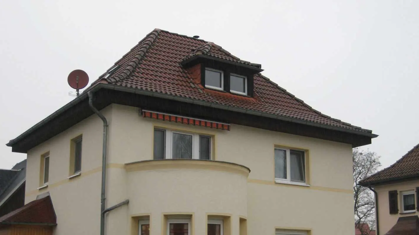 Hipped roof before renovation with PREFA shingles and dormer