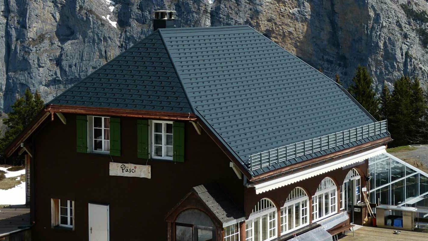 Renovation of a mountain hut roof with PREFA shingles and snow guards