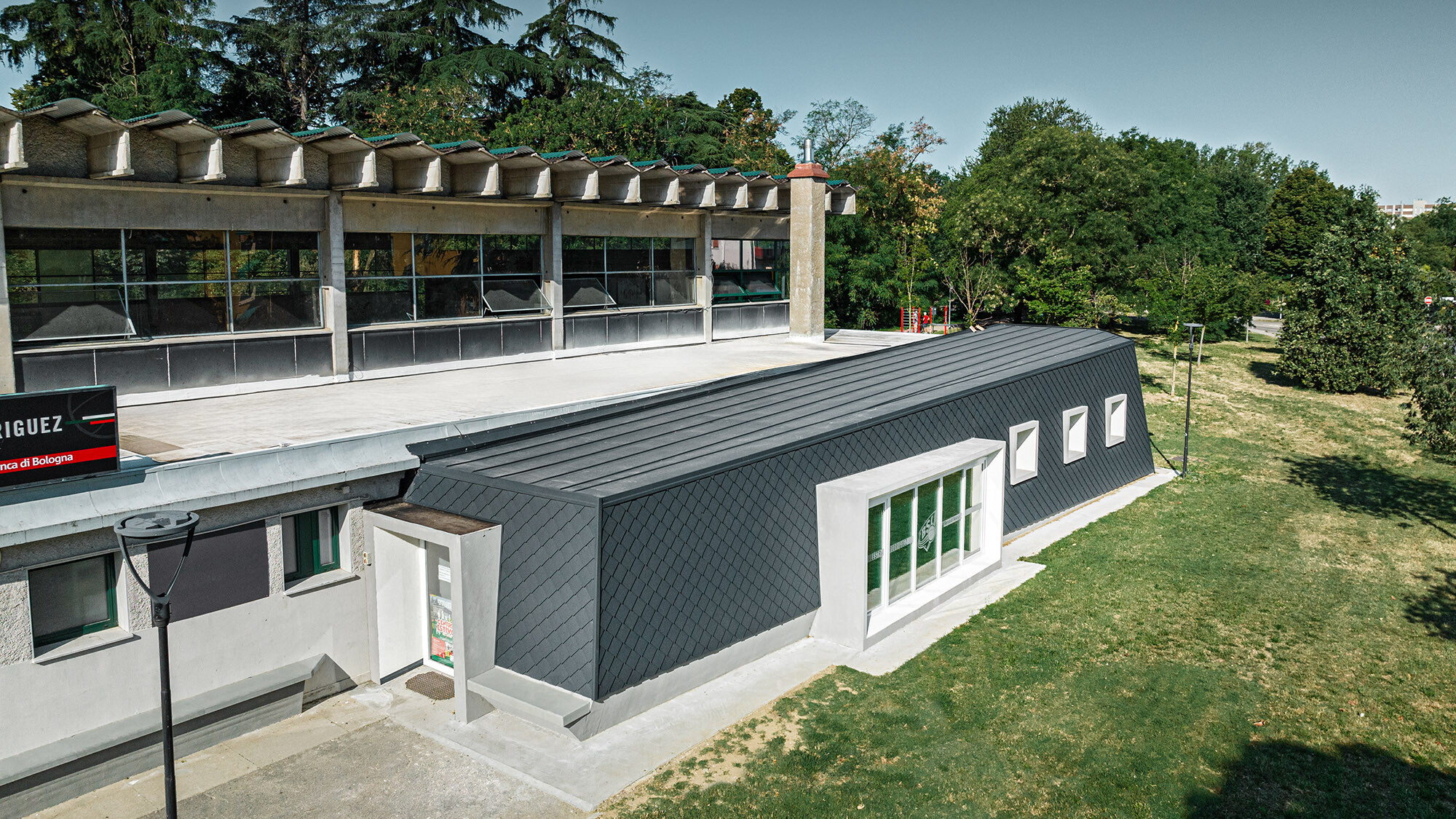 A bird's eye view of the Rodriguez gymnasium and its extension with the park area in front.