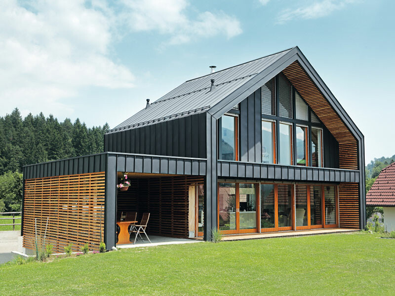 Residential building with flexible and durable PREFA aluminium roof and façade cladding in anthracite.