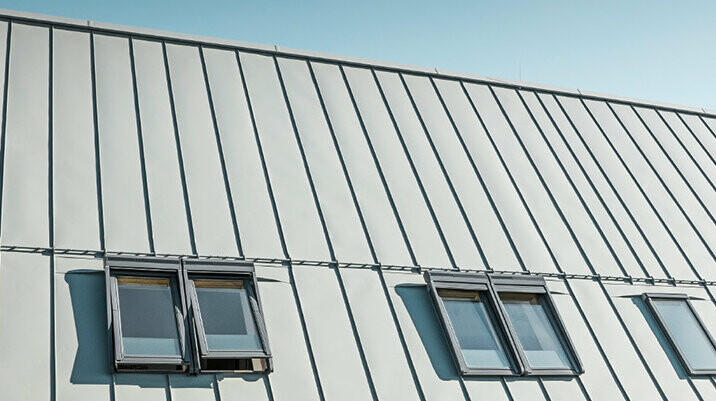 PREFALZ seamed roof in P.10 zinc grey with roof windows