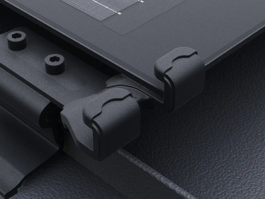 Close-up of the PREFALZ solar panel with black solar module safety lock. The panels are installed directly to the seams on the PREFALZ roof system. 