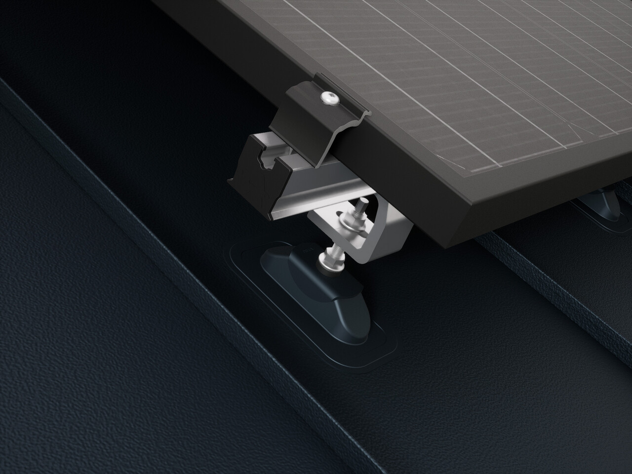 Close-up of the PREVARIO Sunny solar bracket mounted on a PREFALZ roof, which supports the profile rail. The solar module was fastened to the profile rail using the PREVARIO end clamp.