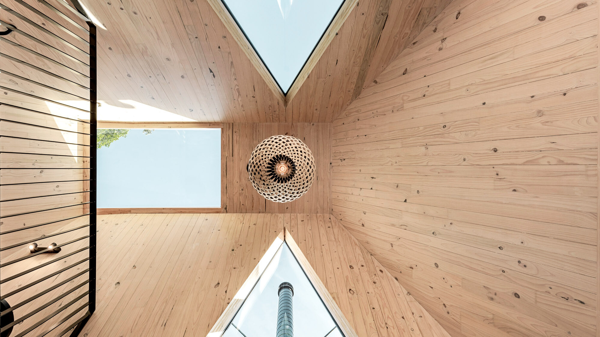 View of the ceiling: The lampshade as well as the three skylights are in view.