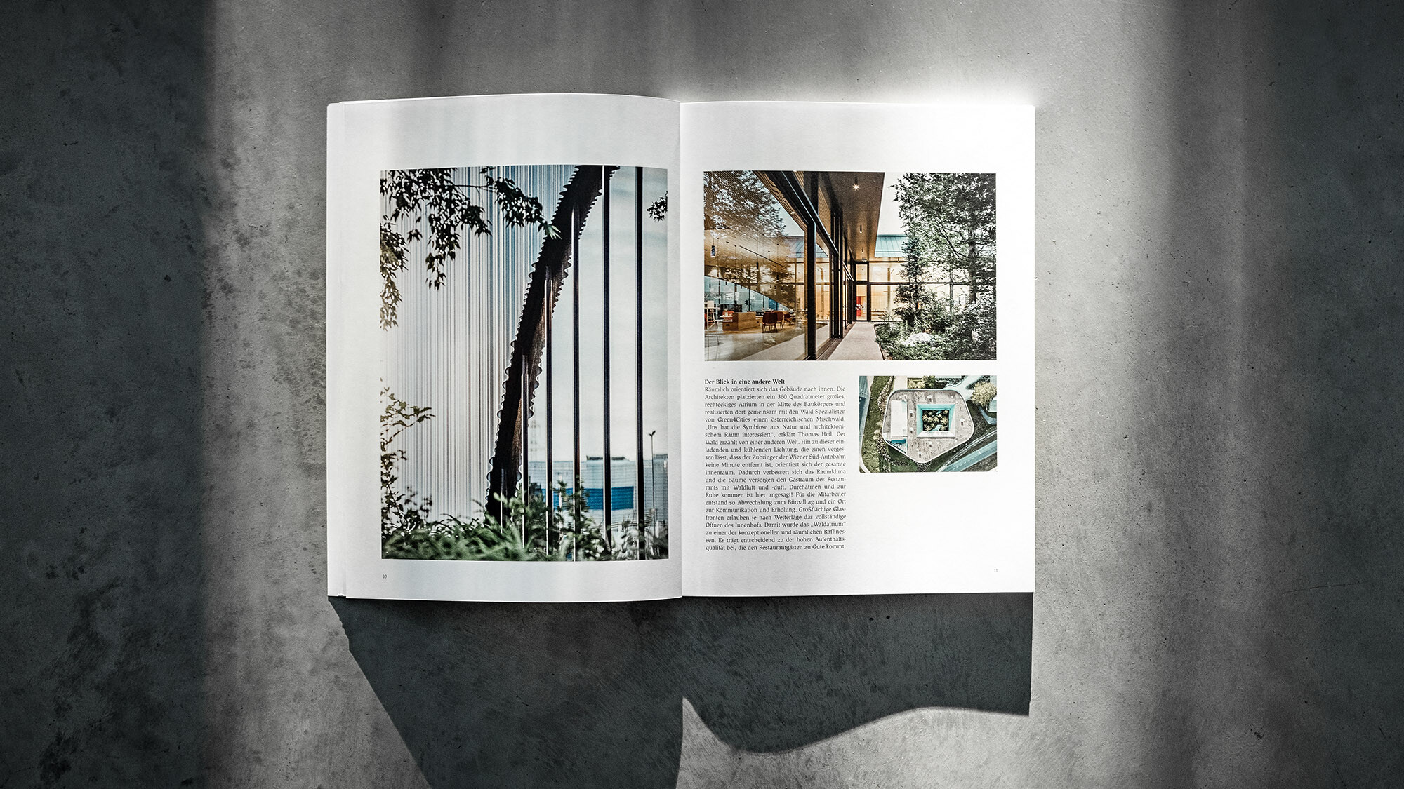 The open PREFARENZEN book 2024 with an article on the project Walters Restaurant by dreiplus Architekten before a grey background.