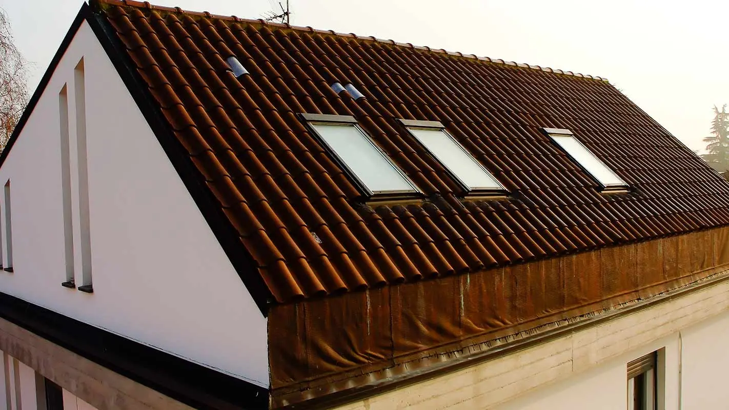Before renovation of a mansard roof with PREFA Prefalz, including roof-top windows