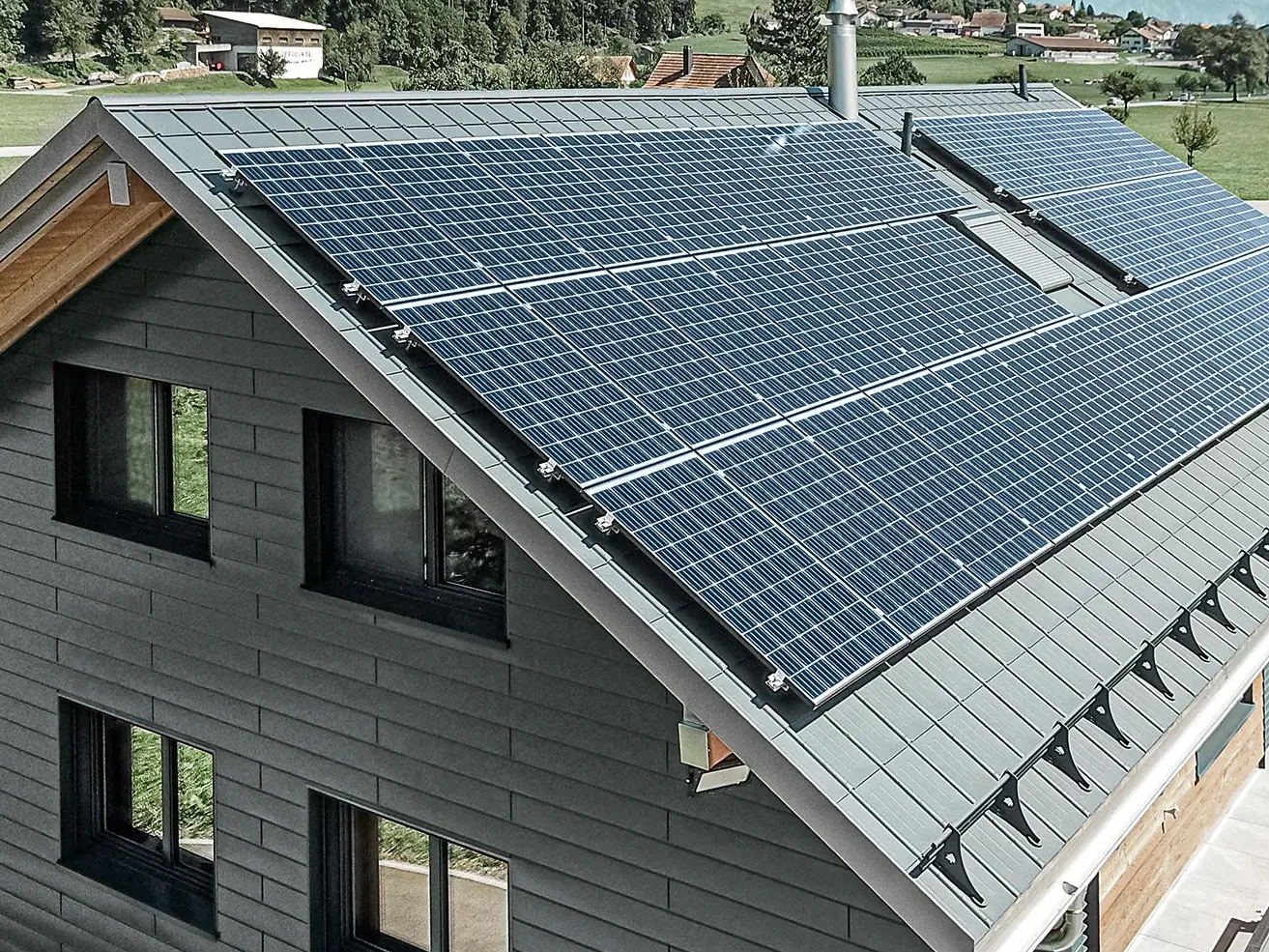 Solar panel system mounted on PREFA roof with  solar brackets and   profile rails for a secure hold.