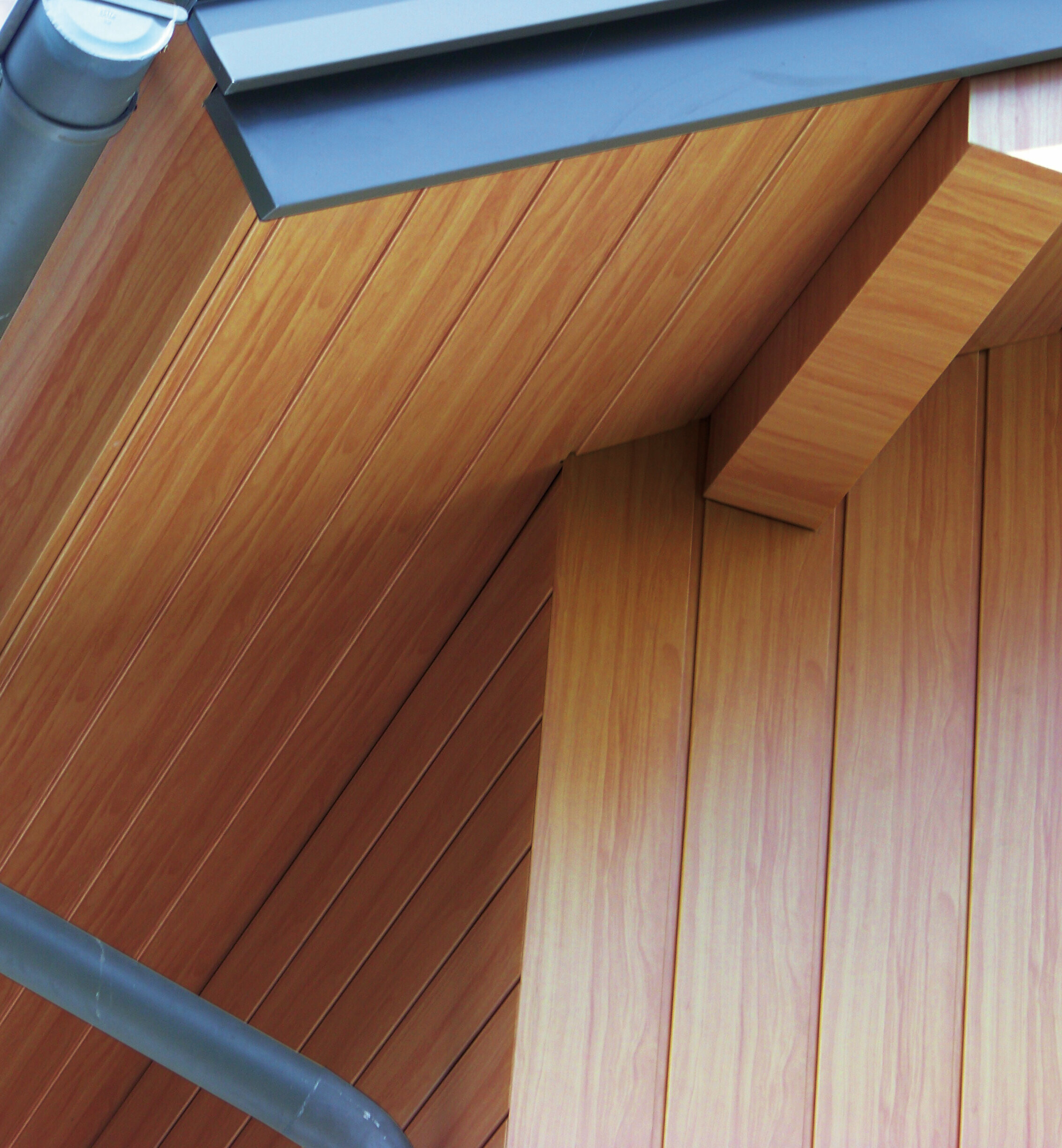 Soffit clad with aluminium PREFA sidings in light wood.