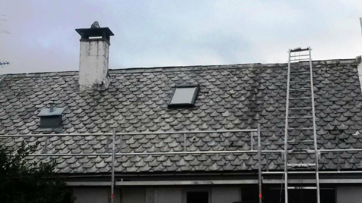 Renovation of a very old roof with PREFA rhomboid roof tiles including chimney