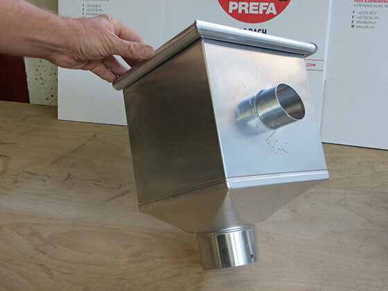 PREFA leader head in plain aluminium with finished DIY emergency overflow.