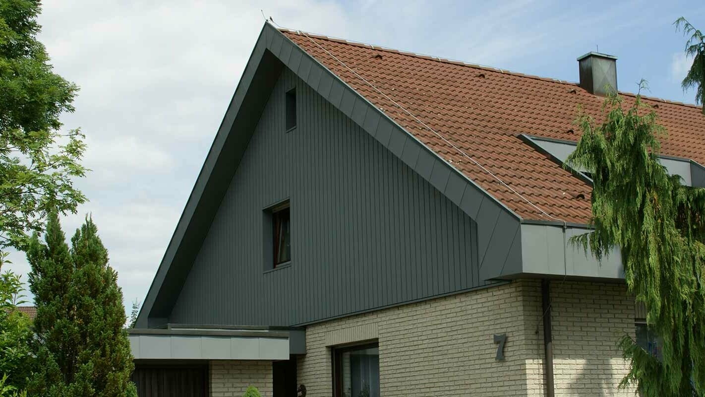 Modern and weatherproof gable gladding after renovation with PREFA sidings, installed vertically