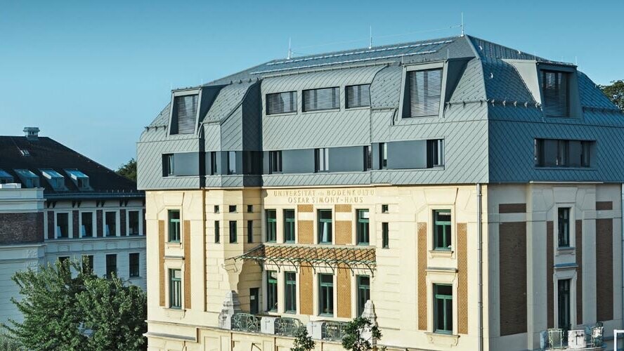 Historic Simony House in Vienna after renovation with PREFA roof and façade tiles in P.10 light grey