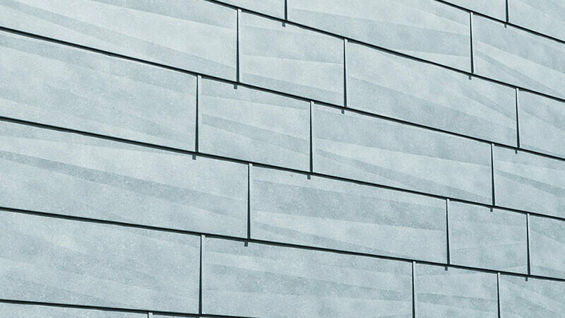 FX.12 façade panel with characteristic edging, P.10 stone grey