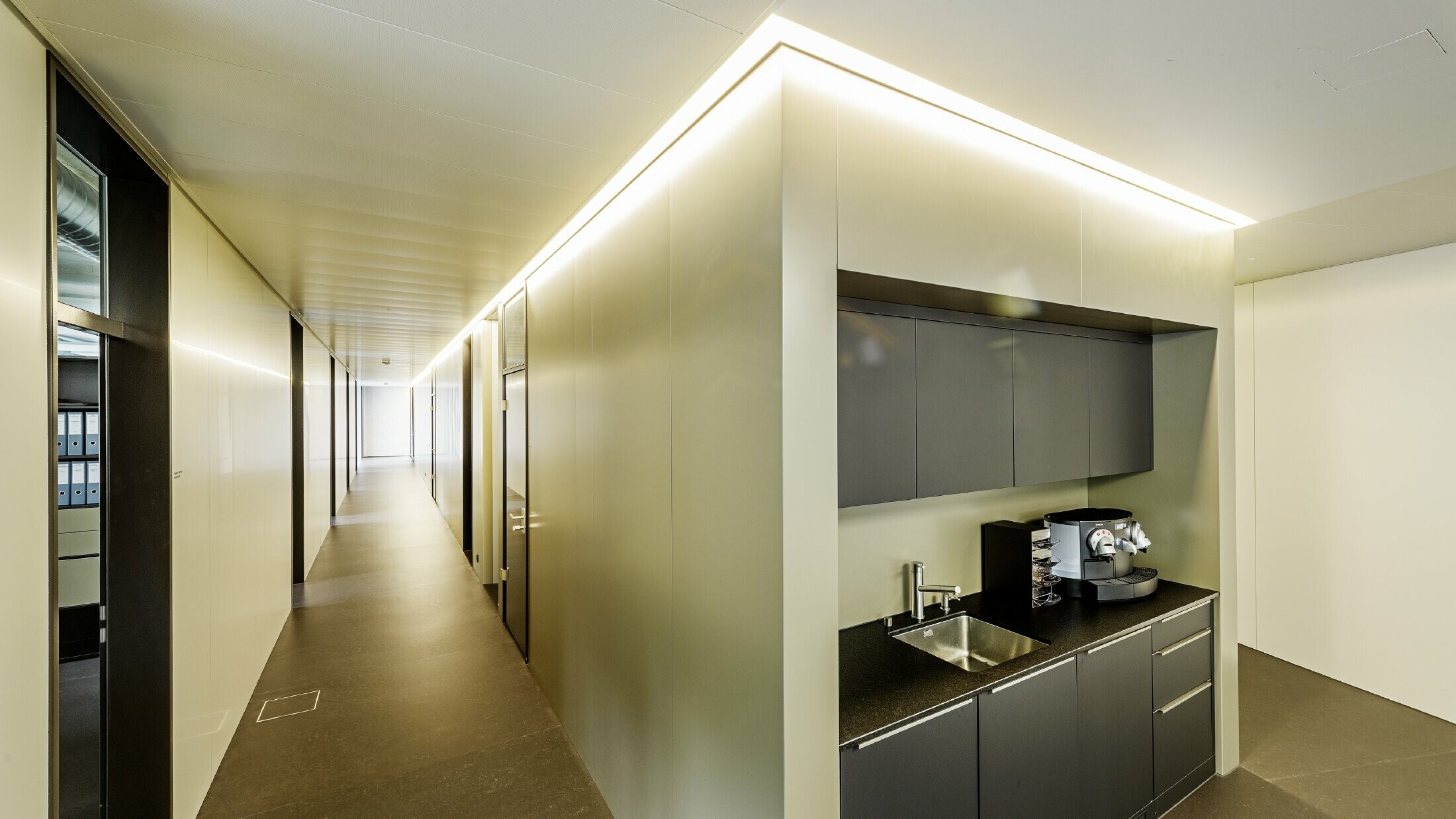 Interior design with indirect lighting with aluminium composite panels in bronze