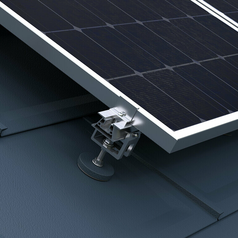 Visible is the PREFA solar mounting system for attaching photovoltaic panels to PREFA roofs.