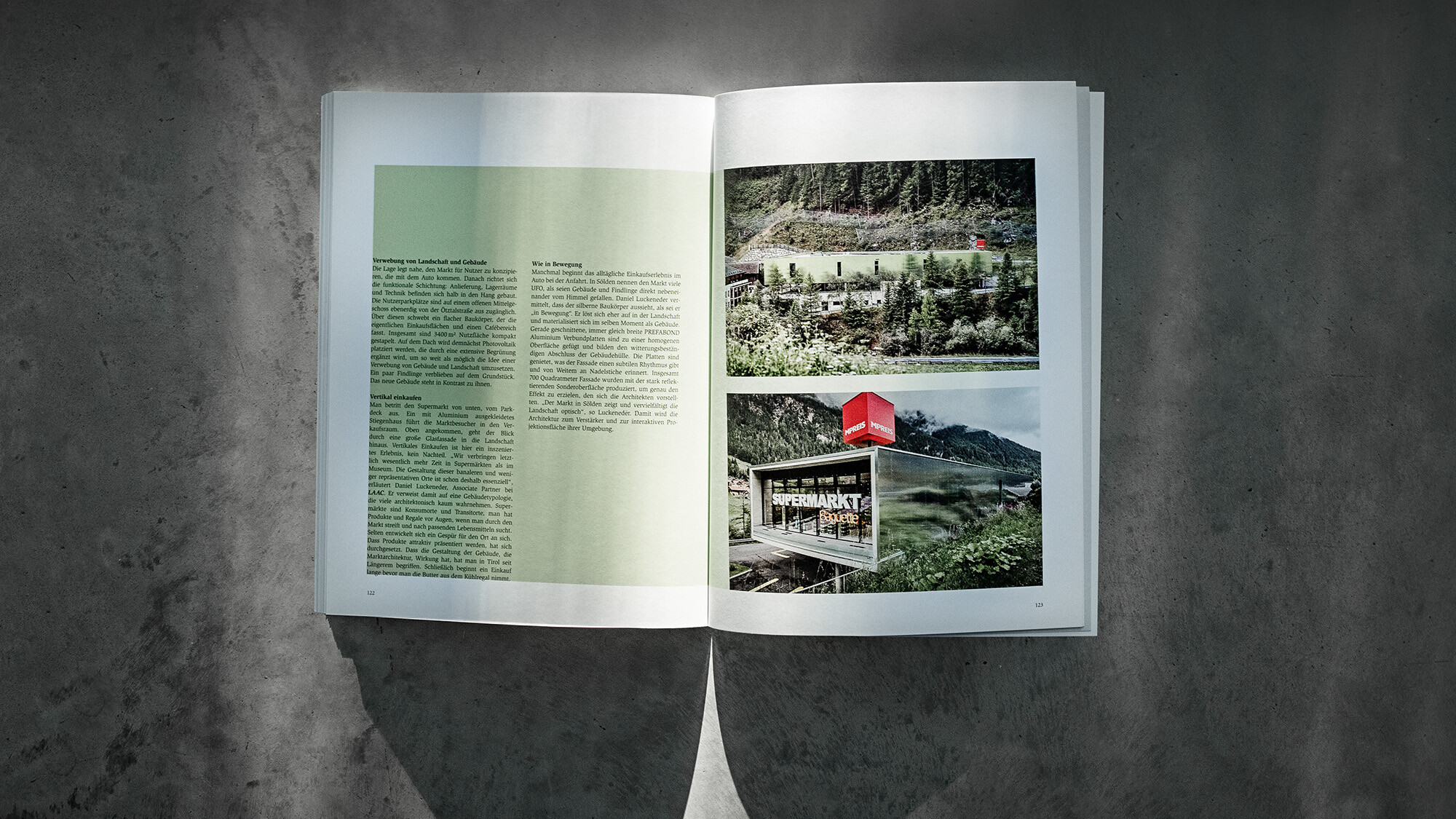 The open PREFARENZEN book 2024 with an article on the MPS MPREIS by LAAC Architekten before a grey background.