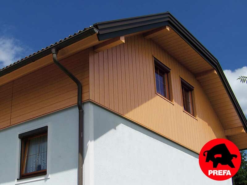 Gable cladding with PREFA sidings in a natural oak finish, including soffit cladding